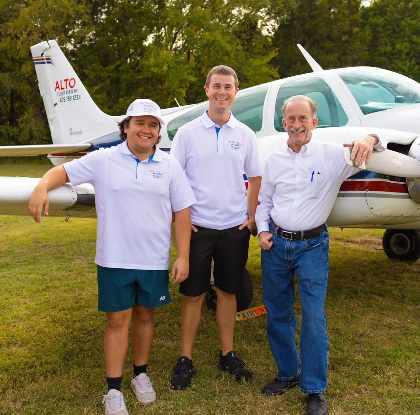 Alto Flight Academy instructors in front of a piper aircraft in Oklahoma City, OK.